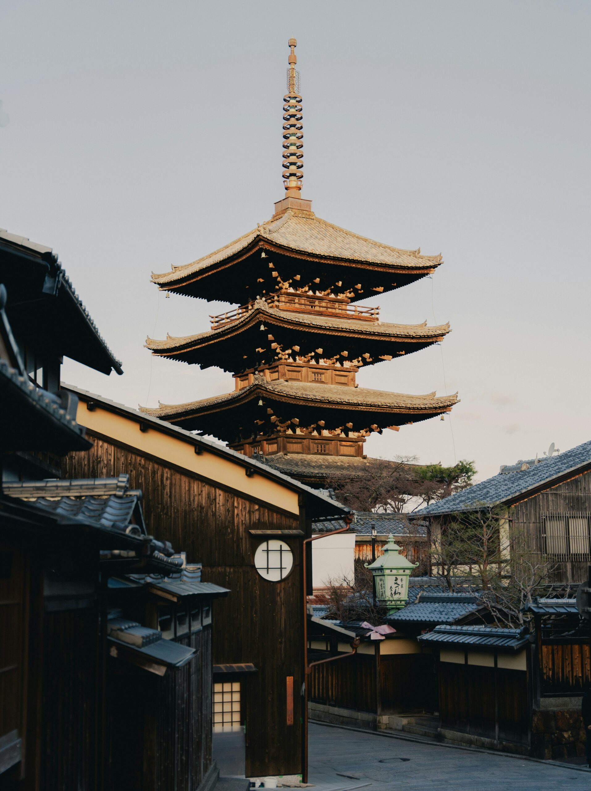 KAN-MORNING-01 · empty street at first light, shutters still down — 3:4, 1100×1466