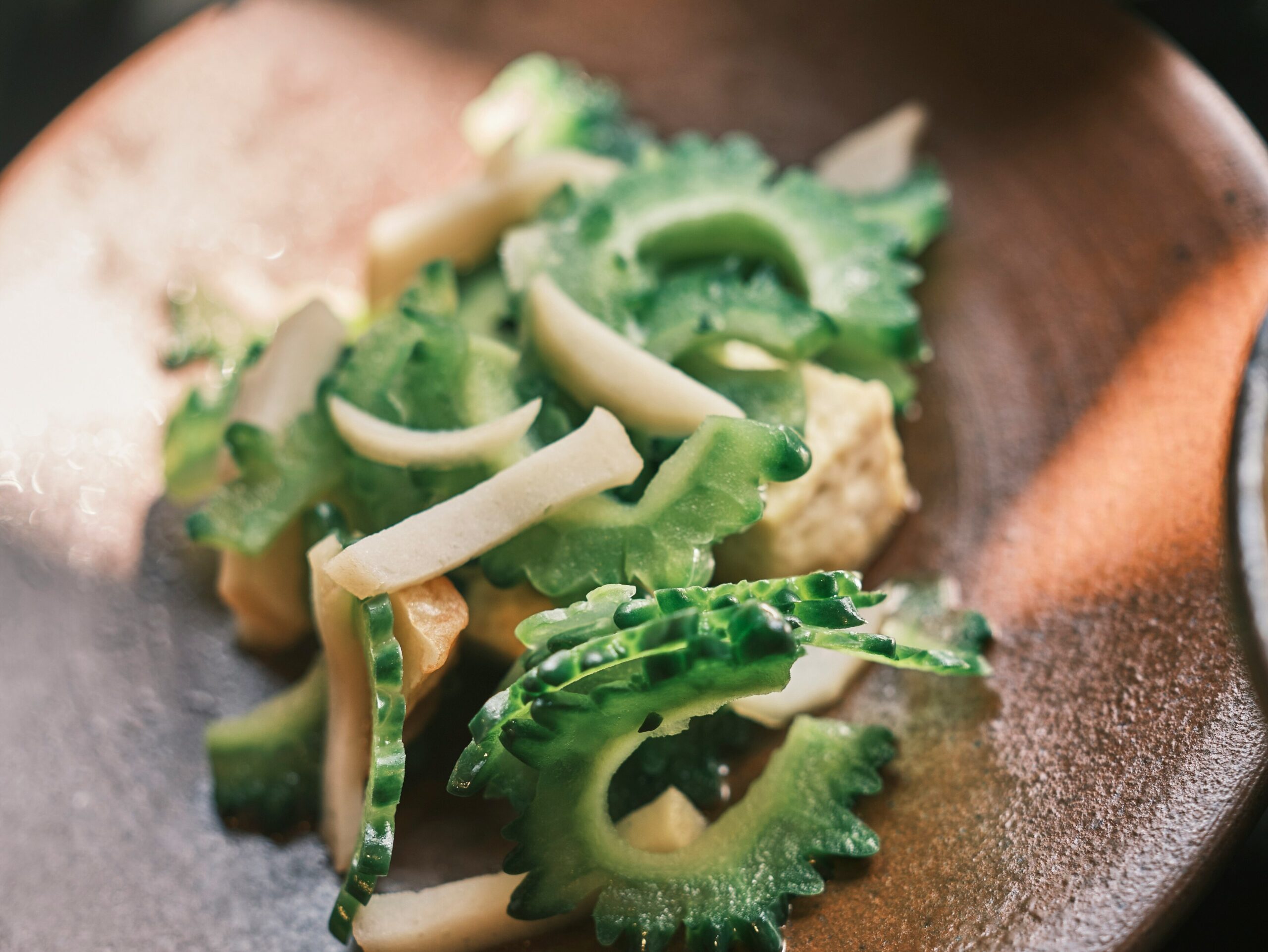 OKI-EAT-02 · goya champuru on a home-style plate, casual and local. 4:3, 1400×1050