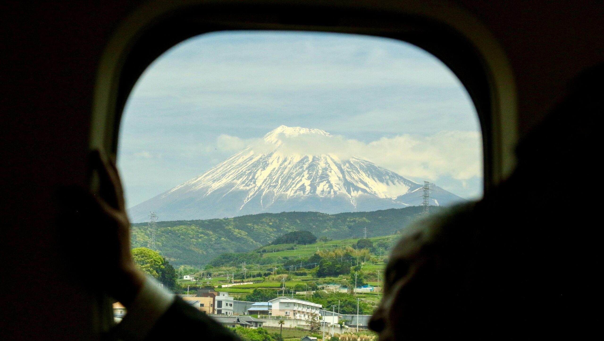 TOK-DETAIL-10 · train window reflection — 16:9, 1400×790